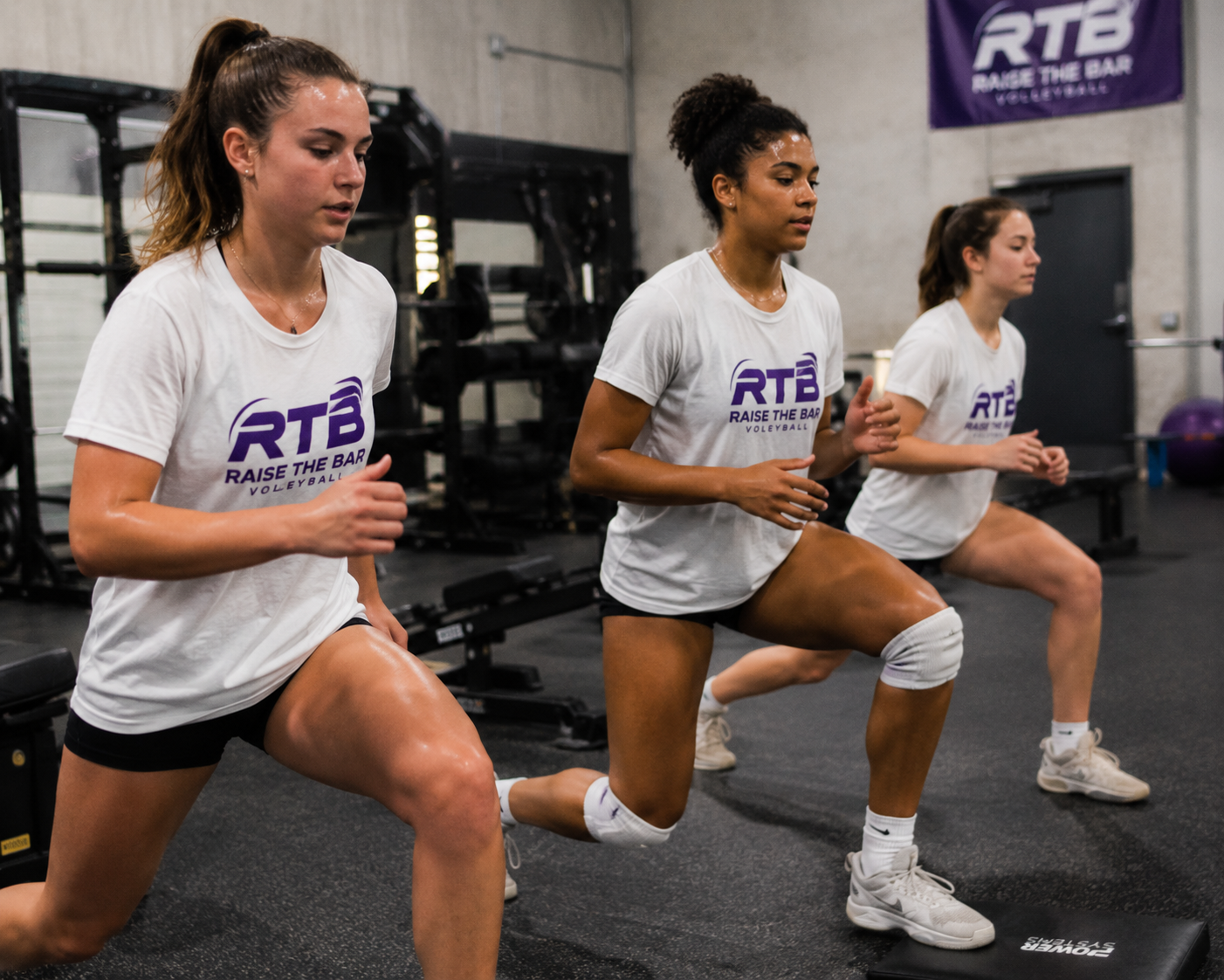 RTB Volleyball players doing strength and agility training workout in gym with focused teenage female athletes.