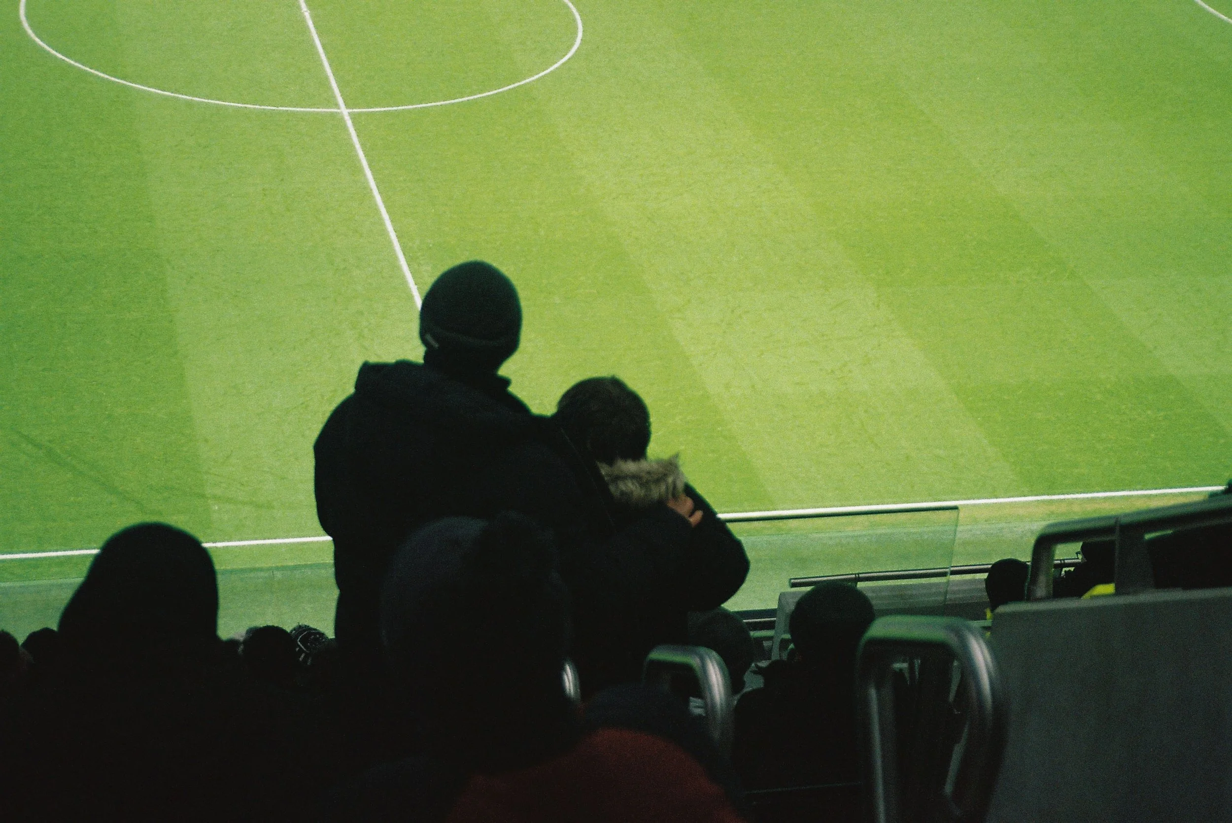 man holding son in front of pitch.jpg