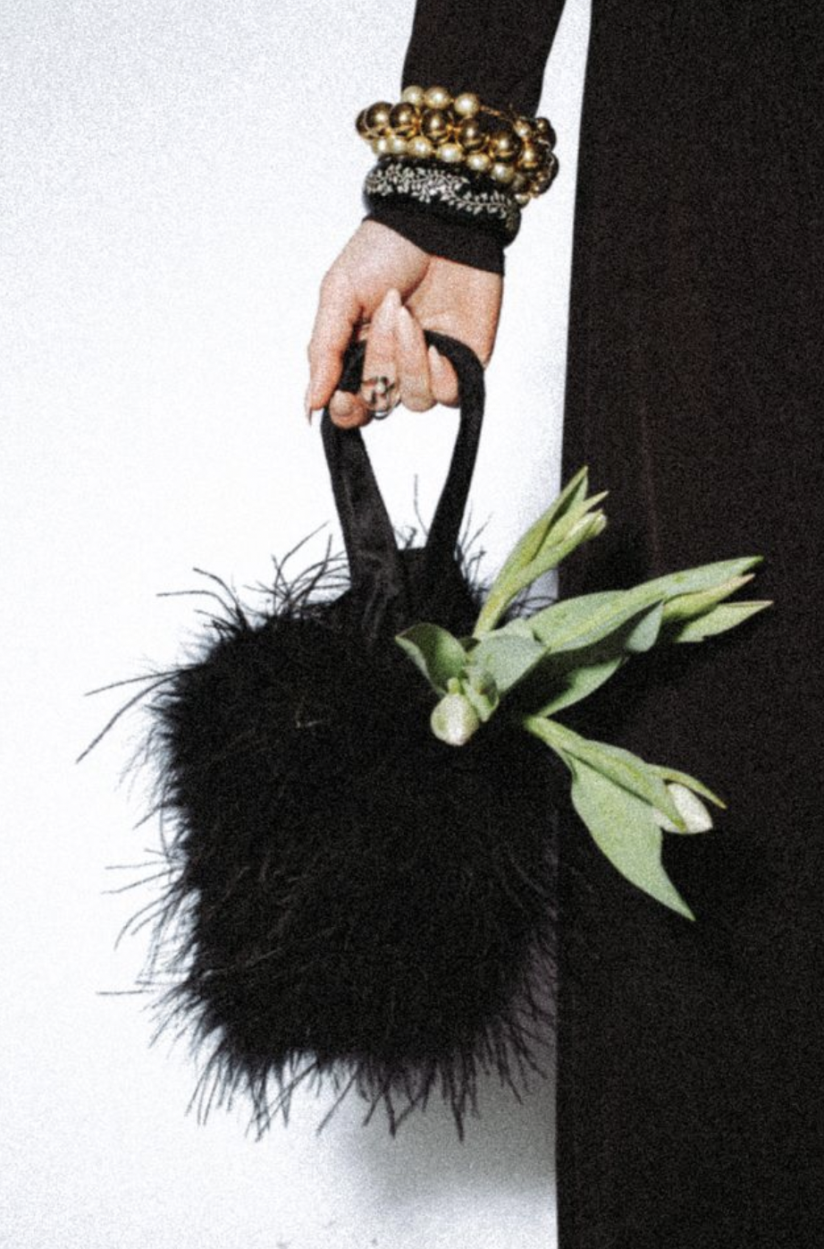 black feather handbag with white tulips
