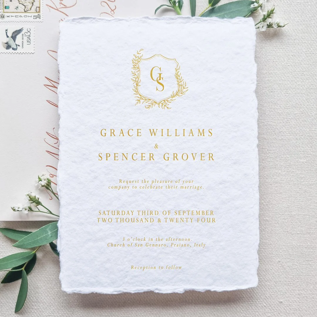 Handmade paper wedding invitation with foil print