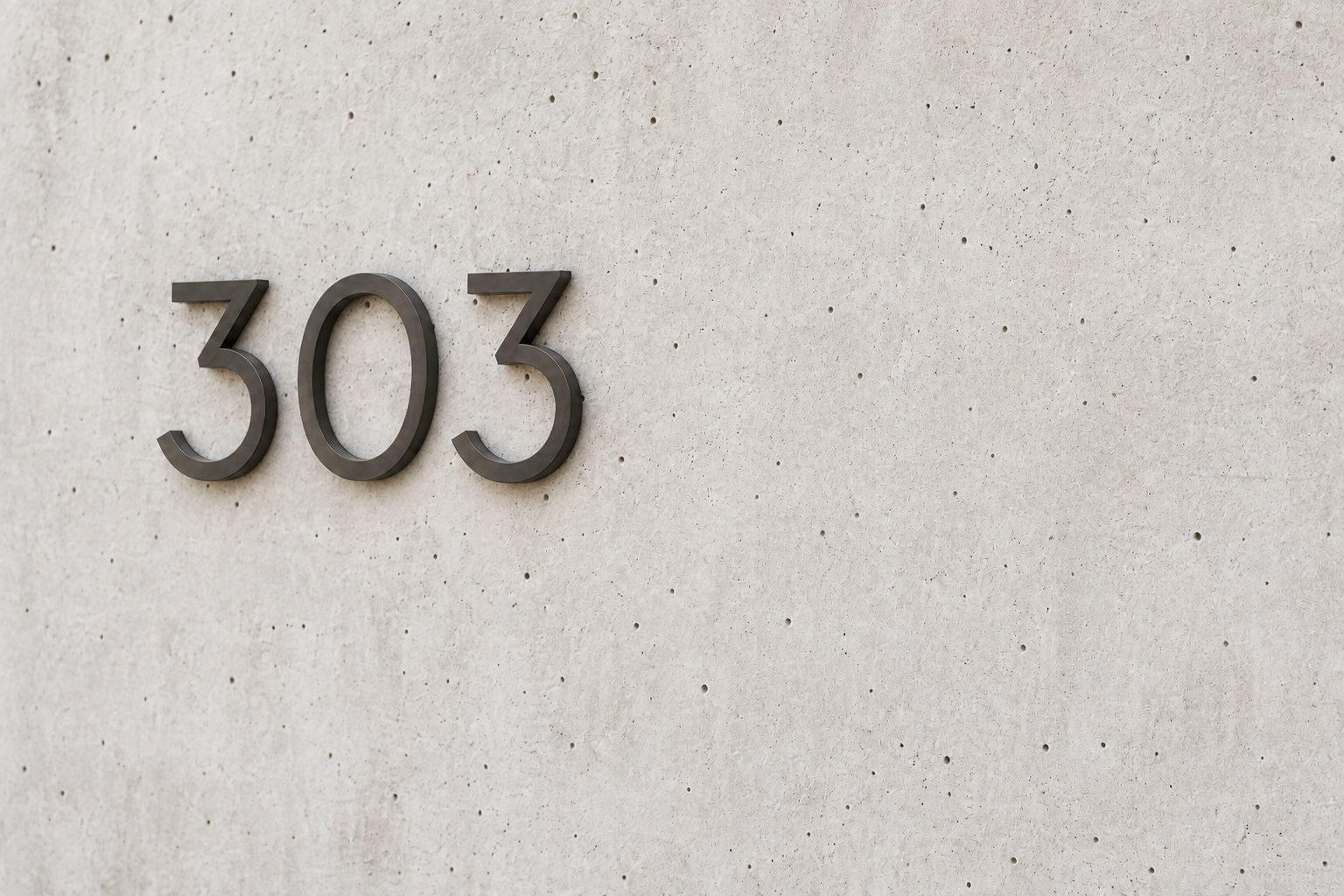 Number '303' mounted on a beige wall with small holes.