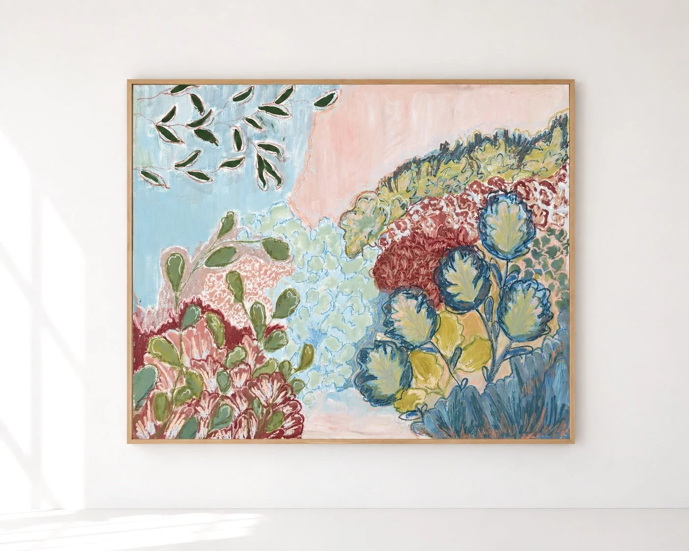 Abstract floral painting with pastel pink, blue, green, yellow, and red colors, framed and displayed on a white wall.