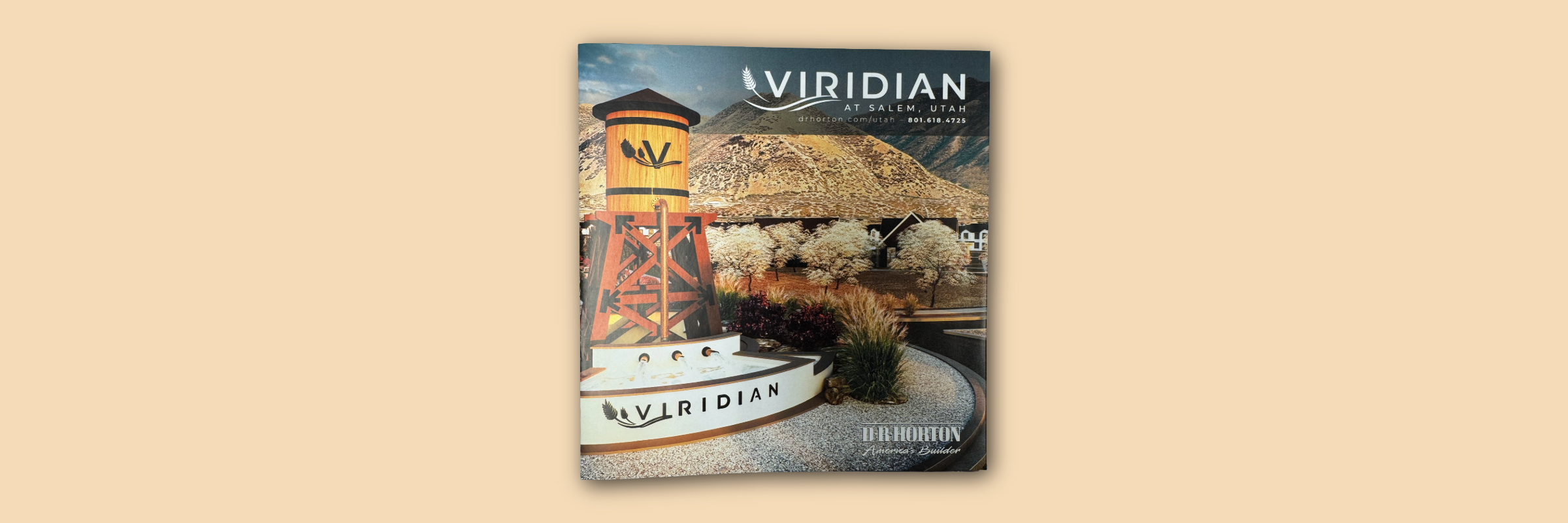 A promotional poster for Viridian in Salem, Utah, featuring a landscape with mountains, trees, and houses, and a wooden water tower with a mountain silhouette, with text including website and phone number.