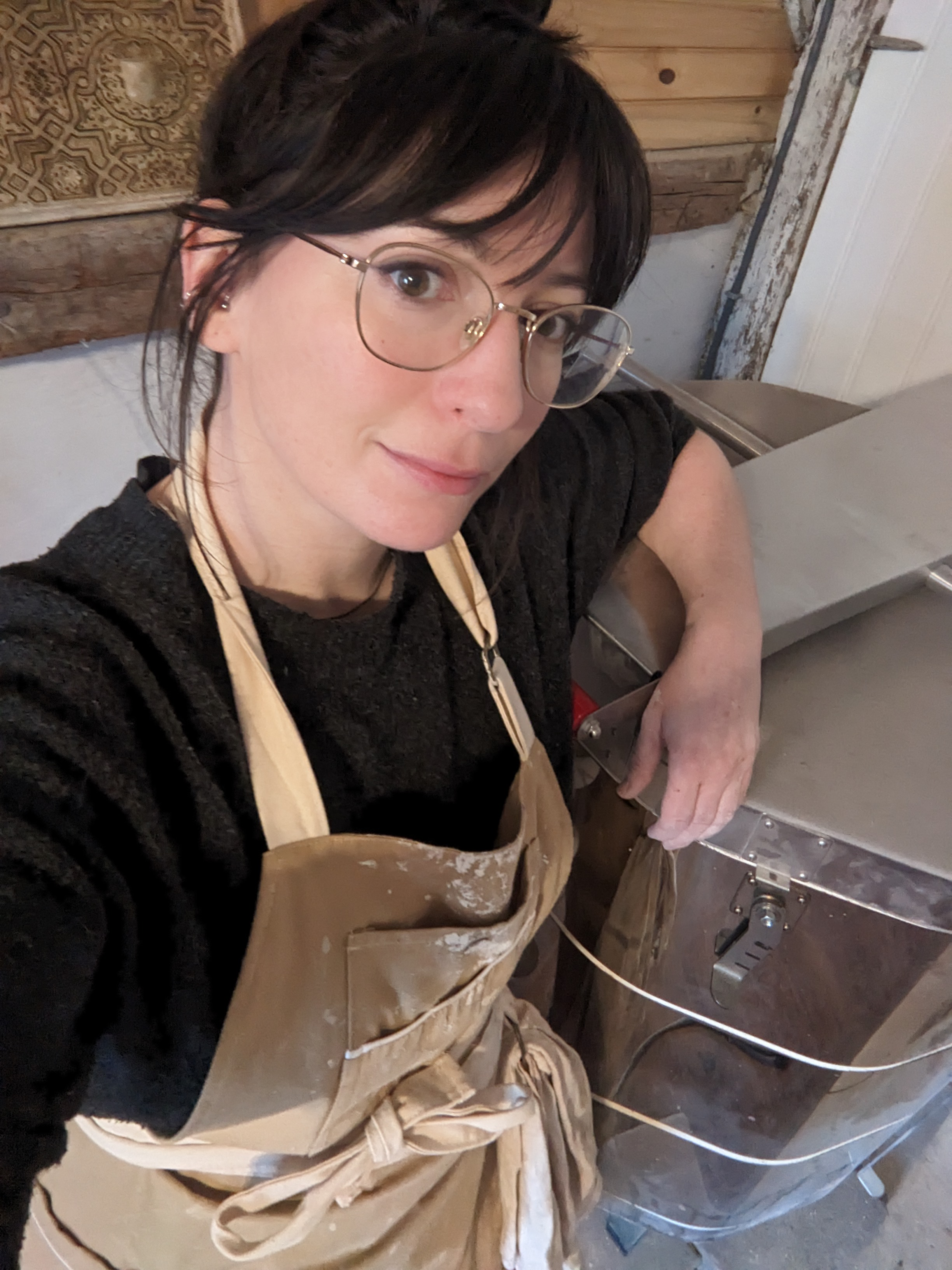 A photo of Casey alongside her kiln