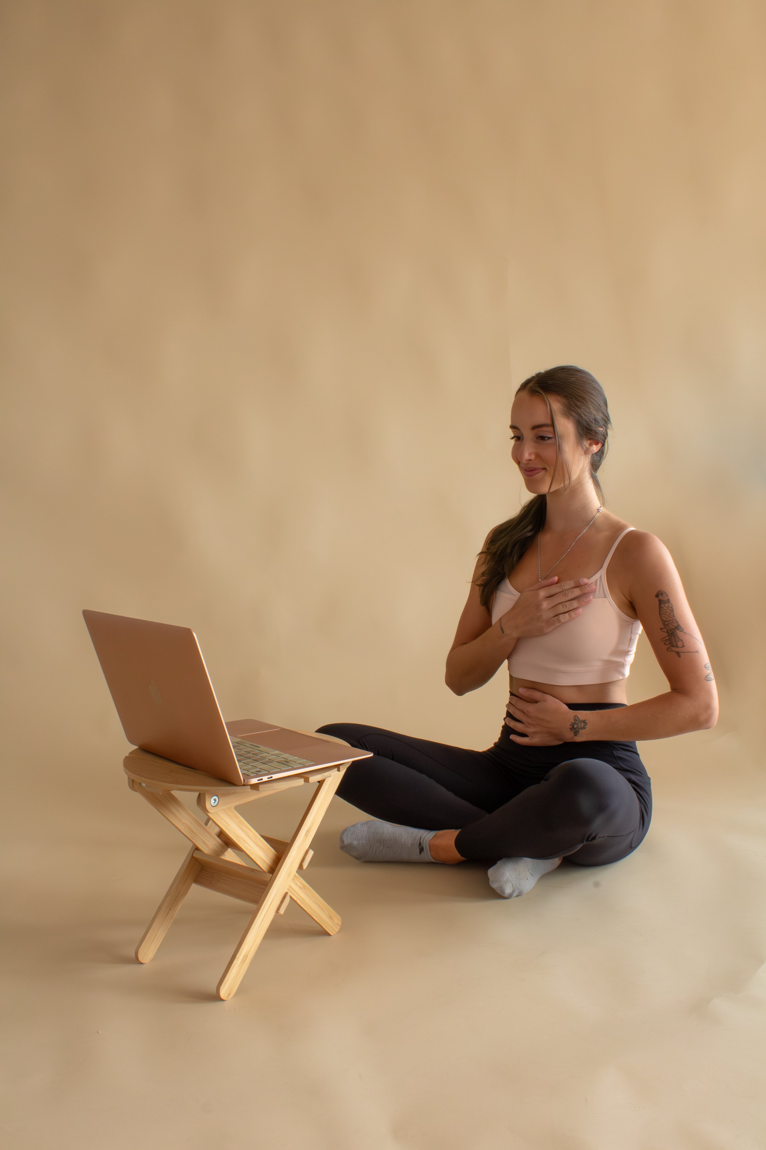 Sarah Teaching Breathwork on Laptop
