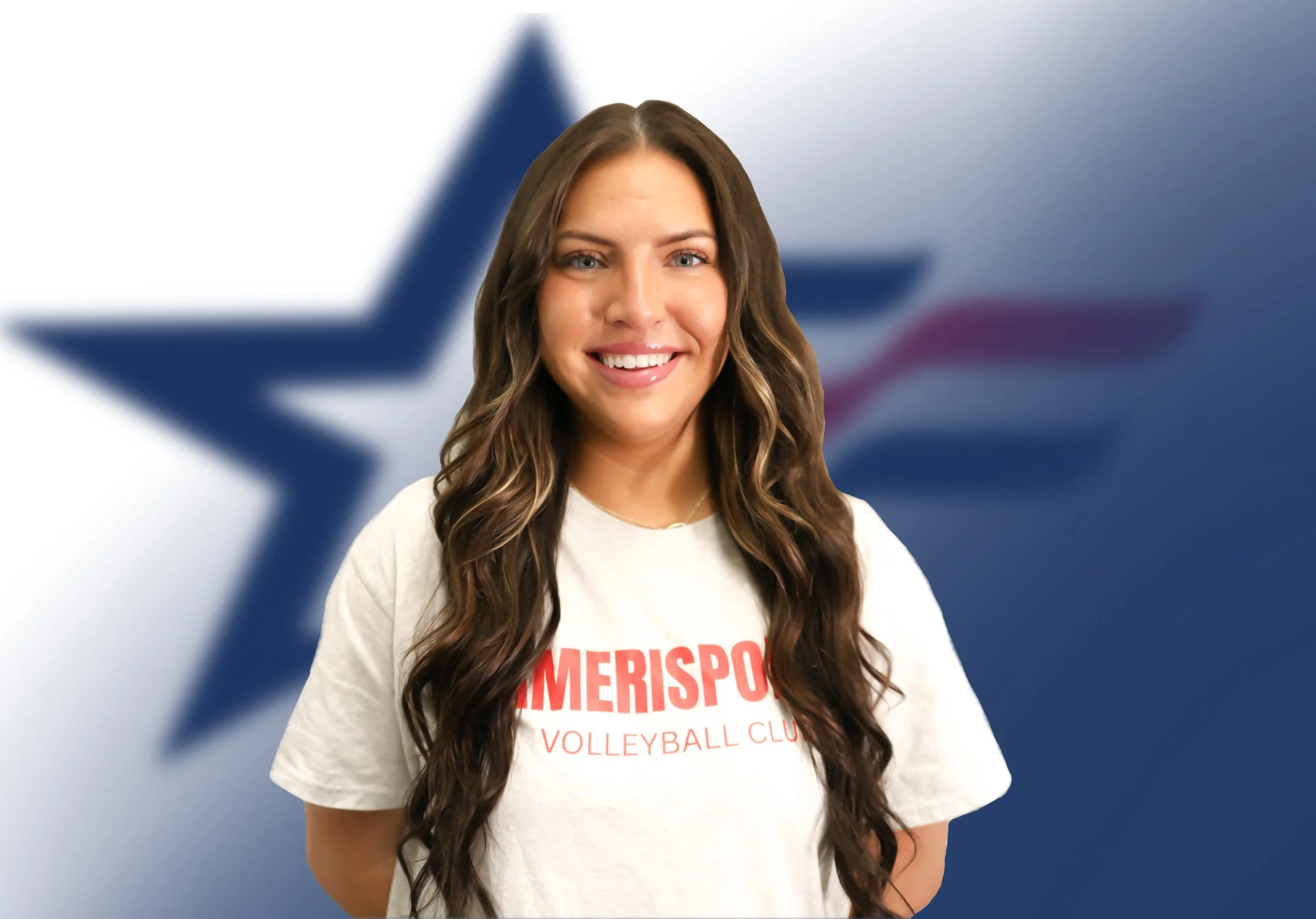 A smiling woman with long brown hair wearing a white volleyball club t-shirt standing in front of a blurred American and Texas flag background.