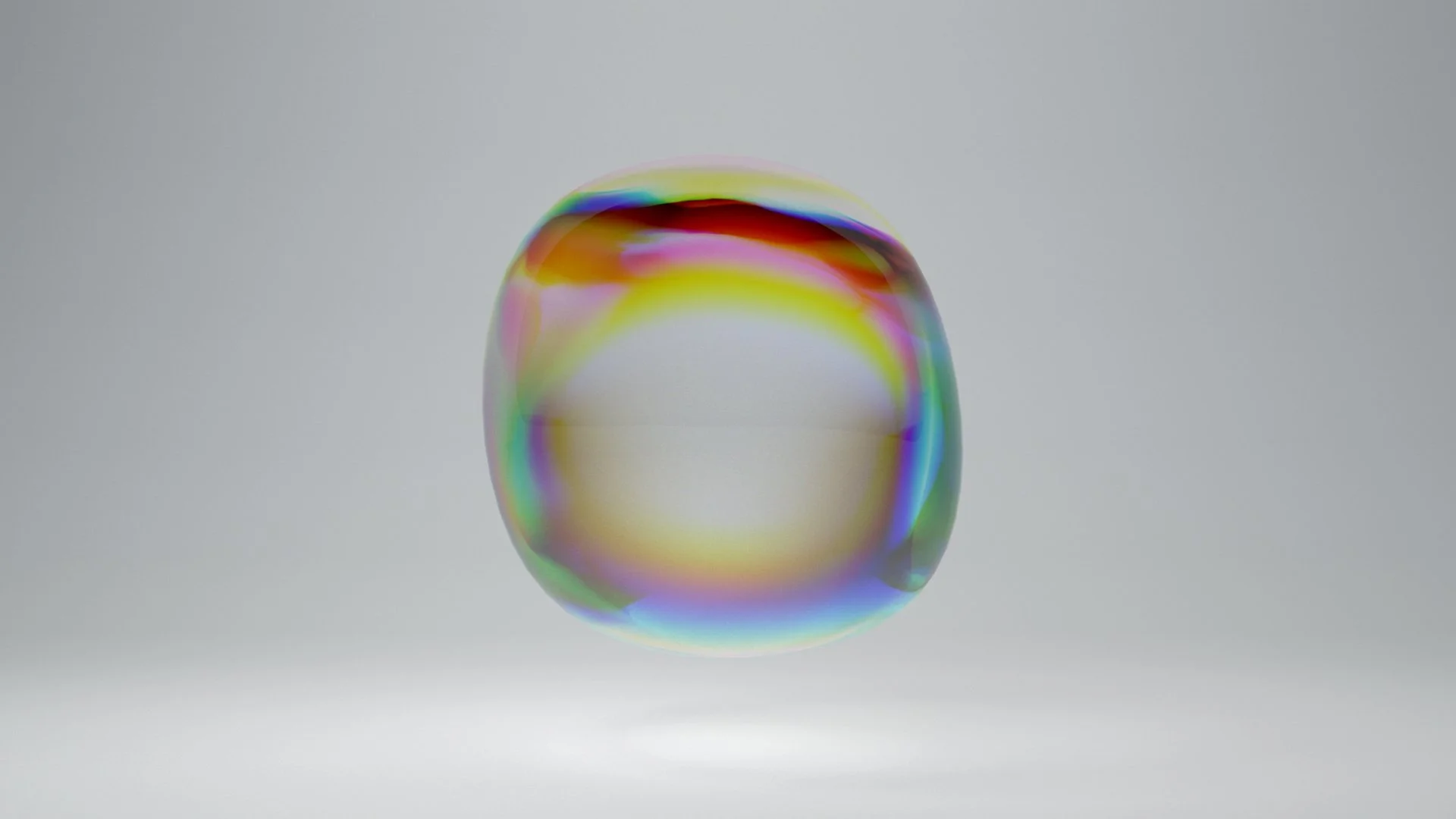 Close-up of a colorful soap bubble against a plain gray background.