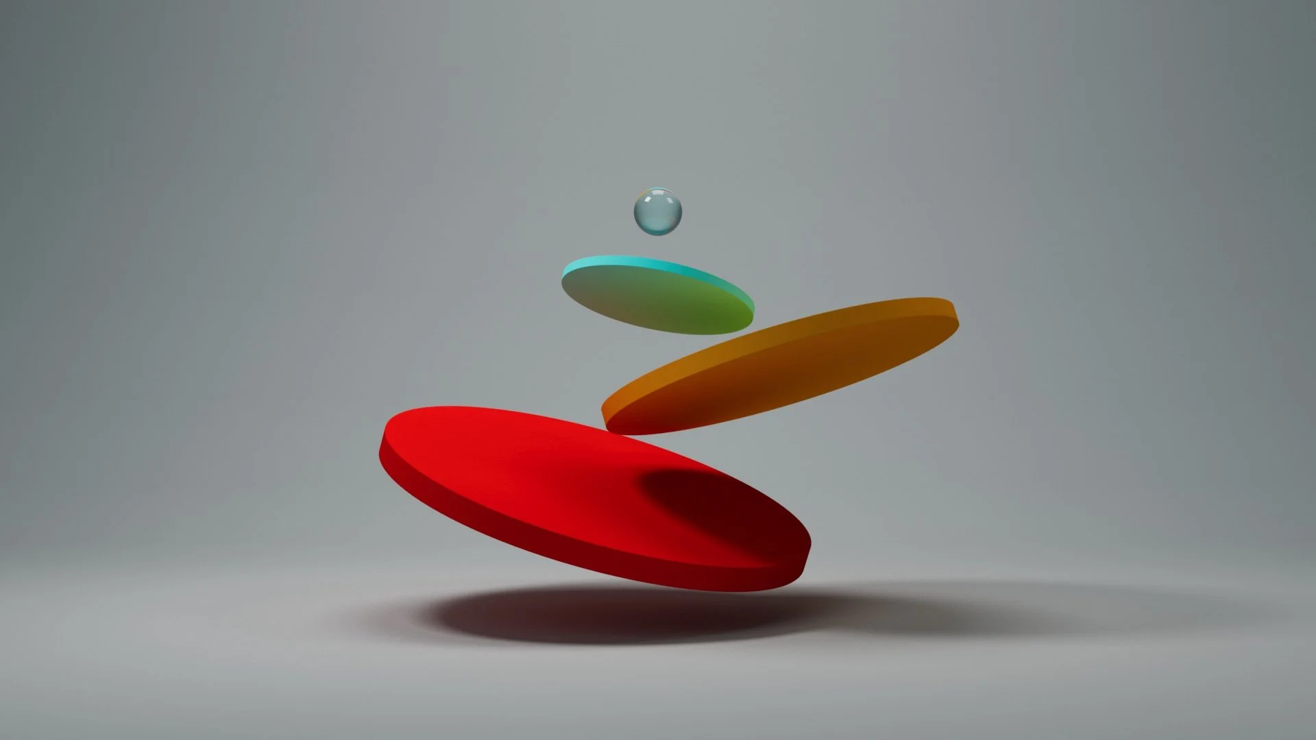 Falling colorful discs with a small glass ball in the middle on a plain gray background.