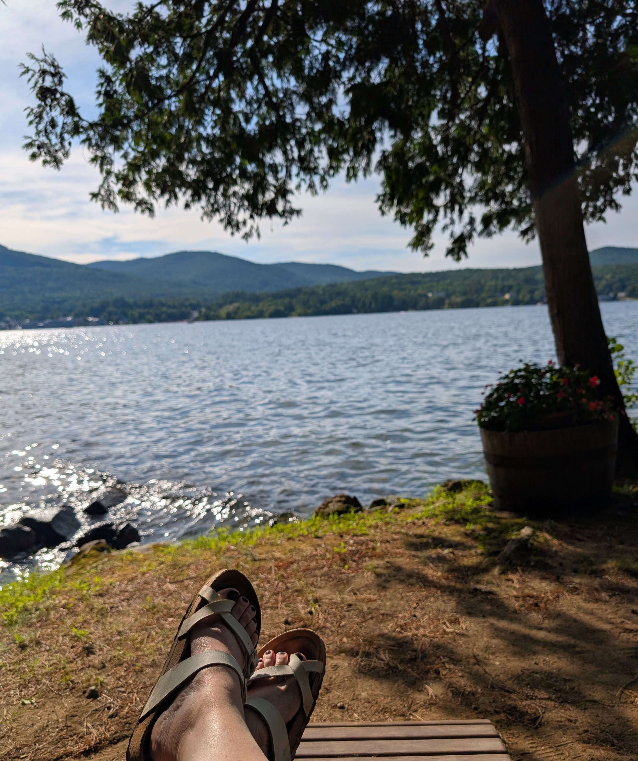 Image of someone relaxing by a lake