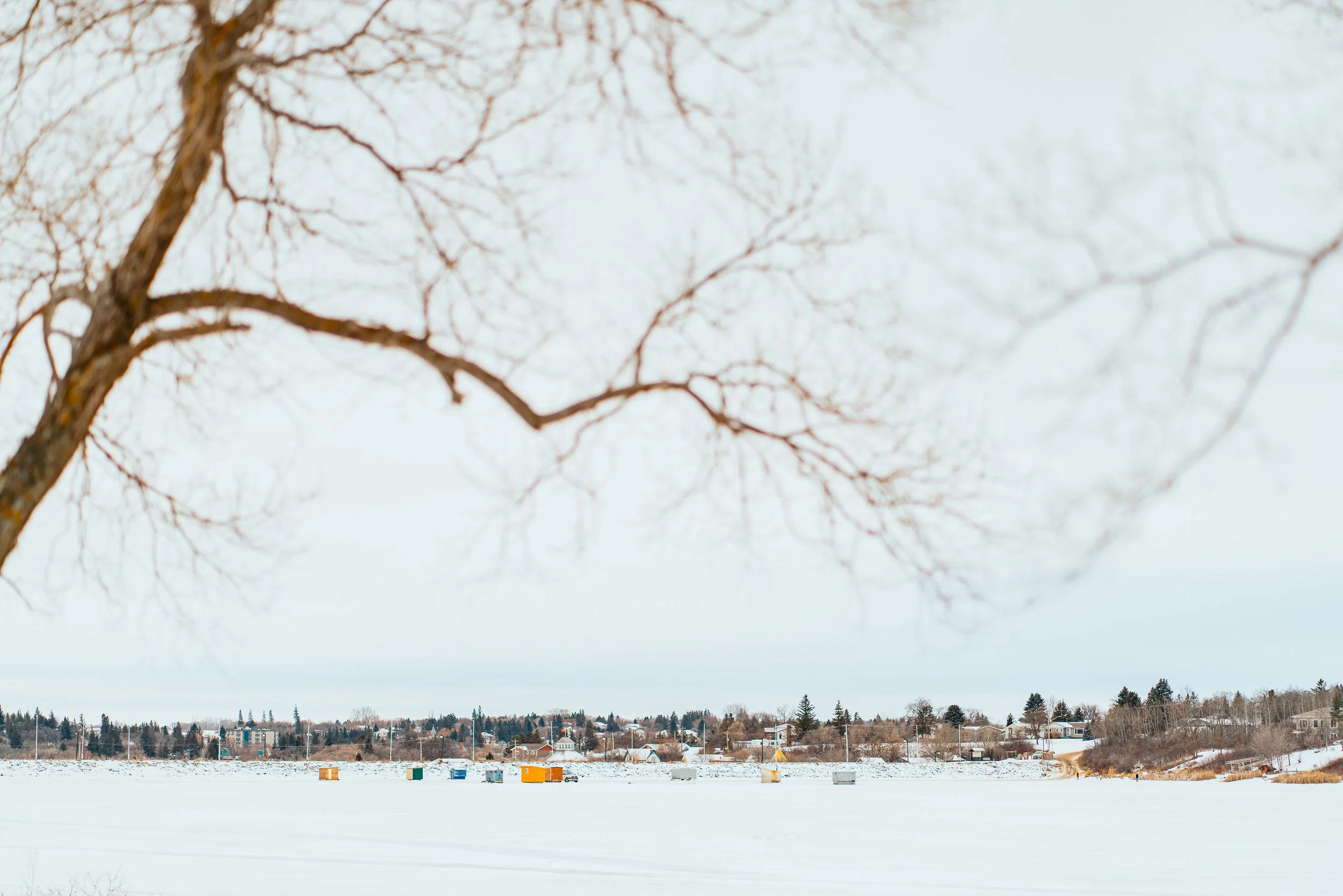 Ice fishing shacks in the winter on Minnedosa lake.jpg