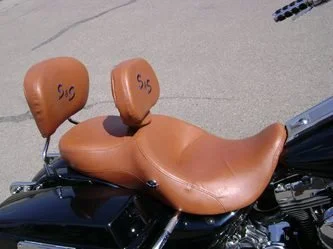 Close-up of a motorcycle seat with brown seats 