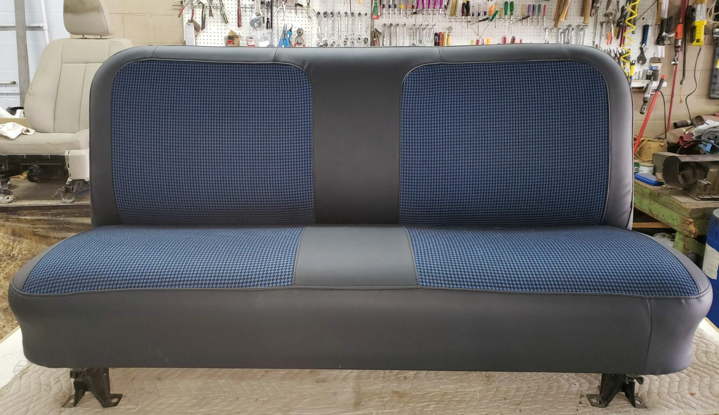 A black and blue houndstooth insert bench seat.