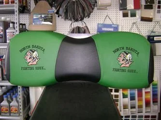 Green golf cart backrest with ND Fighting Sioux logos on both sides.