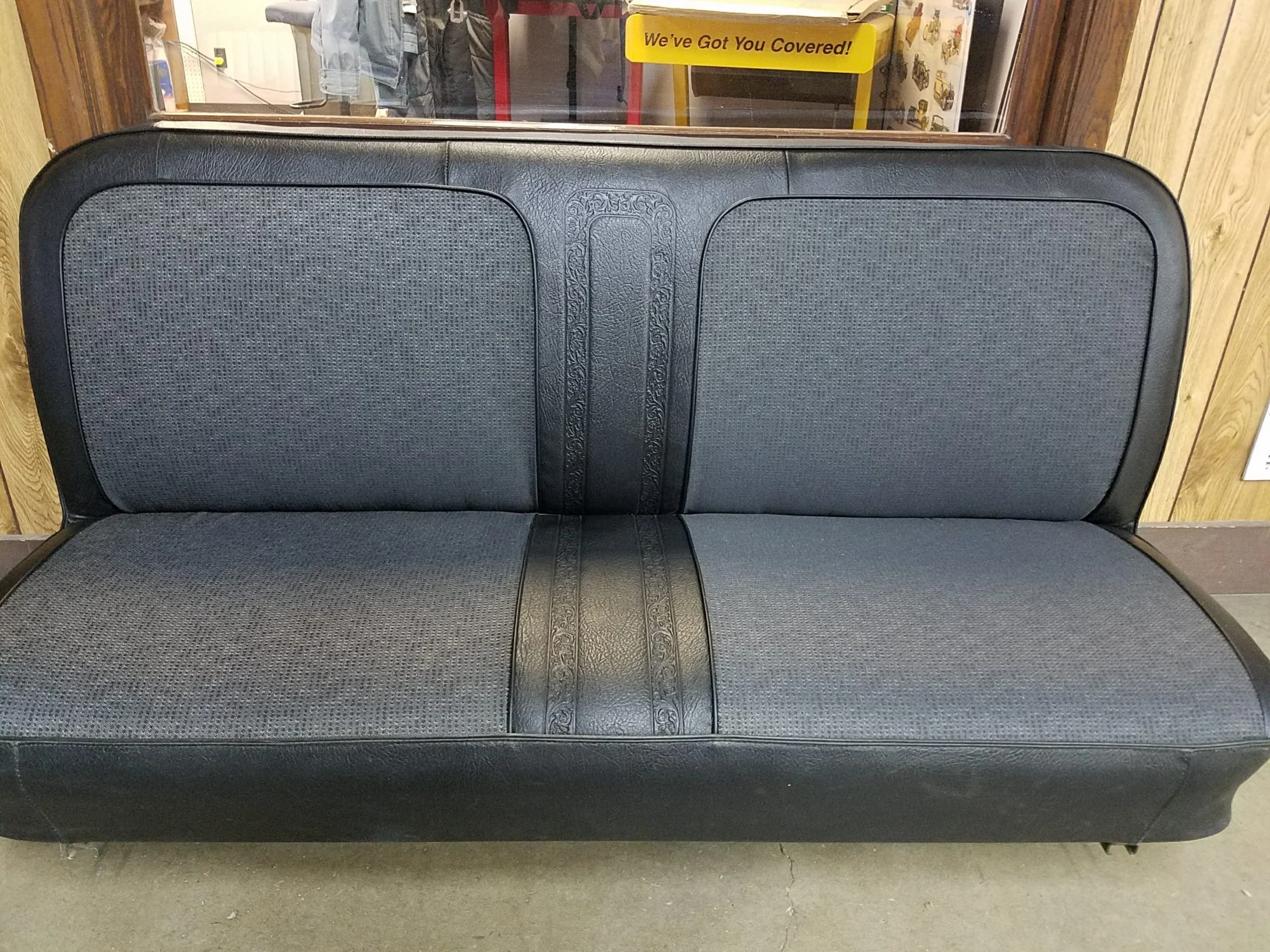 Black Bench seat with patterned cloth inserts. Reused OG vinyl