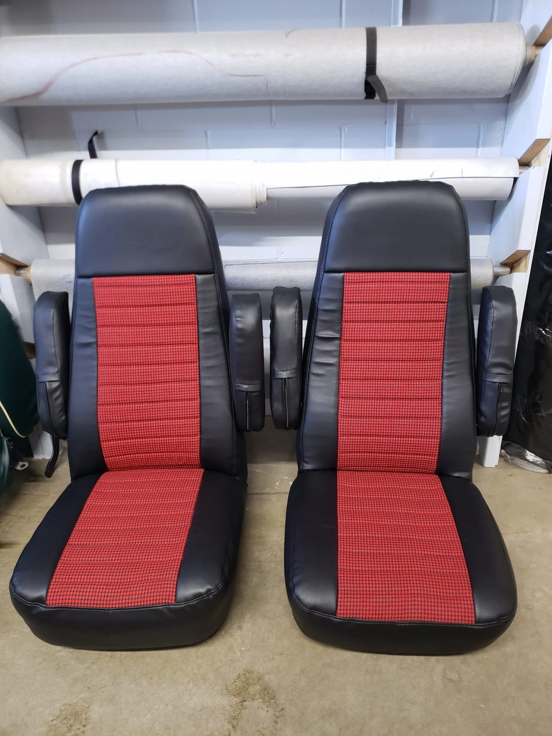 Two black and red racing-style car seats.