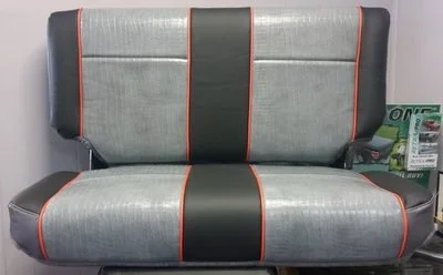A Jeep bench seat with gray vinyl, light grey crocodile vinyl and orange accents.