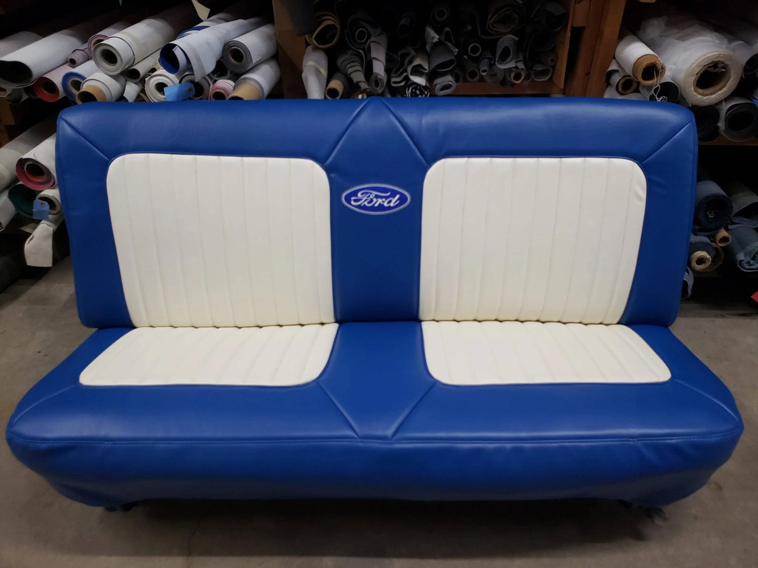 A royal blue and white Ford logo'd bench seat