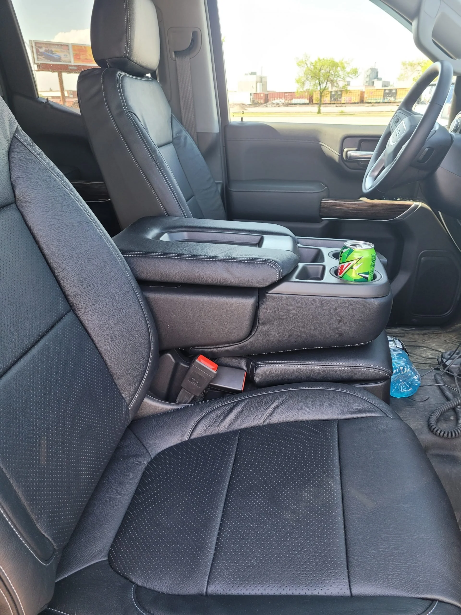 Interior of a vehicle showing black leather seats, Katzkin Leather Kit.