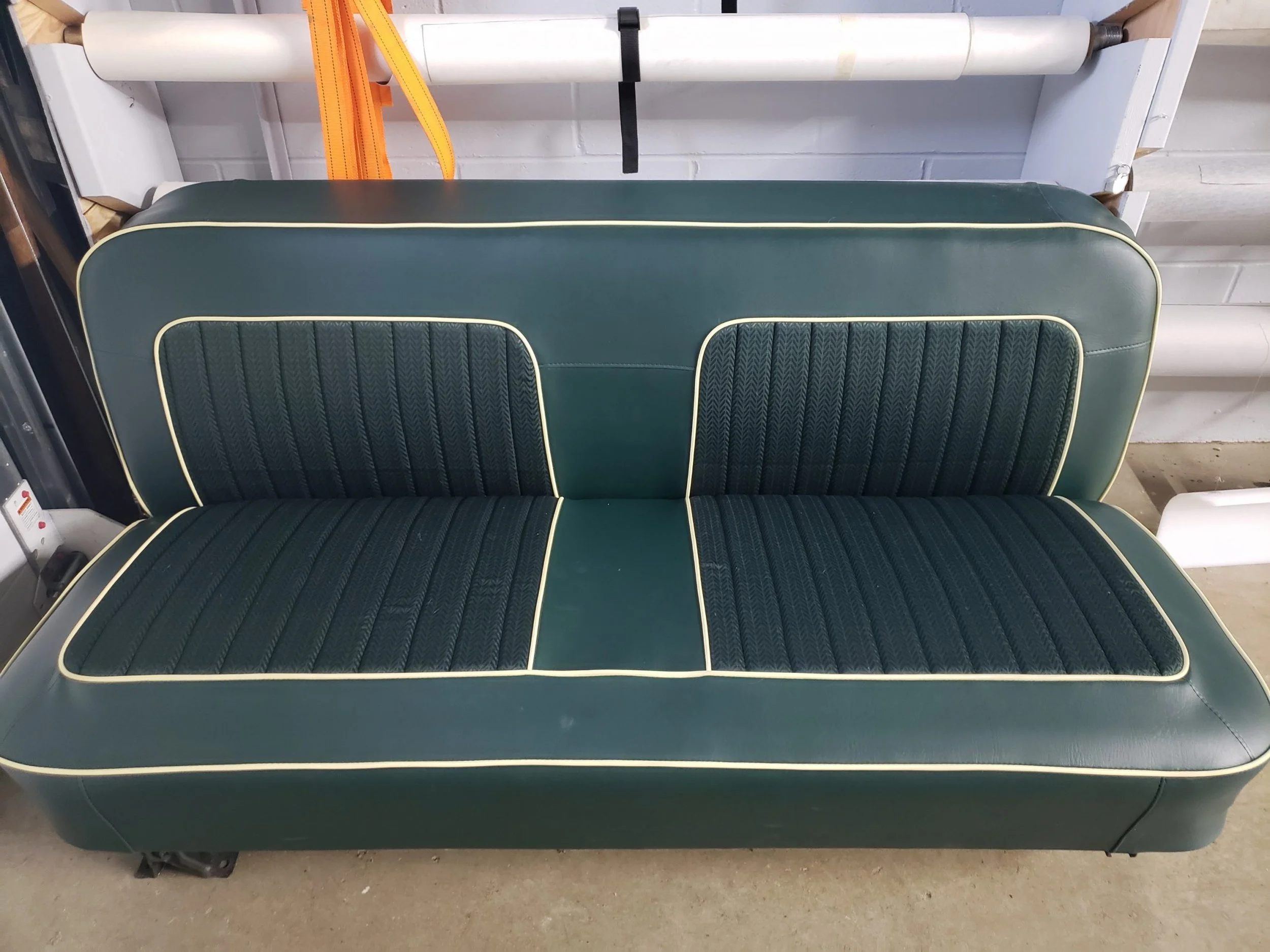 Green vintage bench seat with yellow piping and cloth inserts