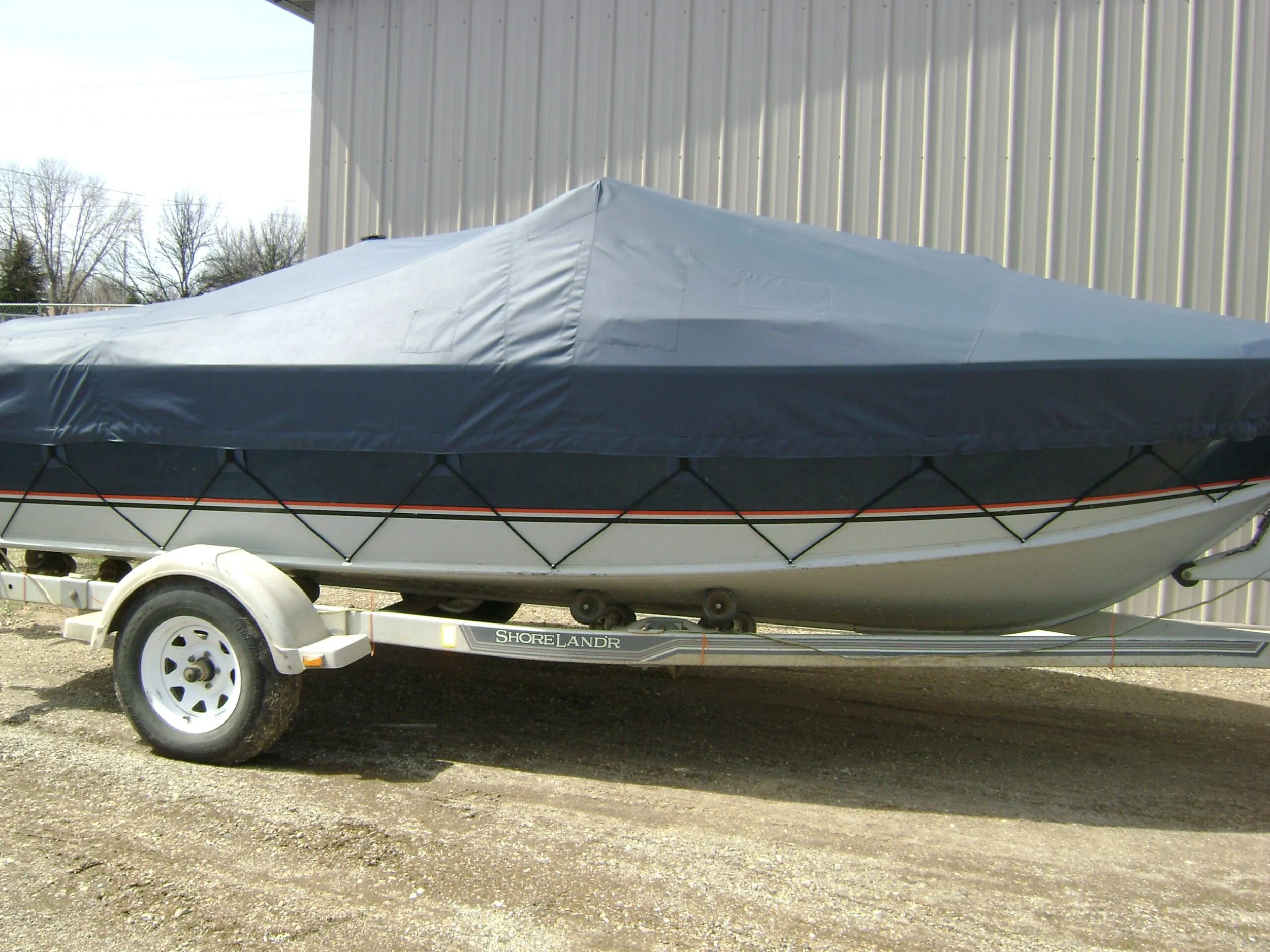 A navy blue strap-on boat cover