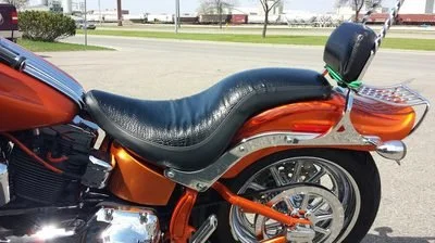 Orange motorcycle with black seat