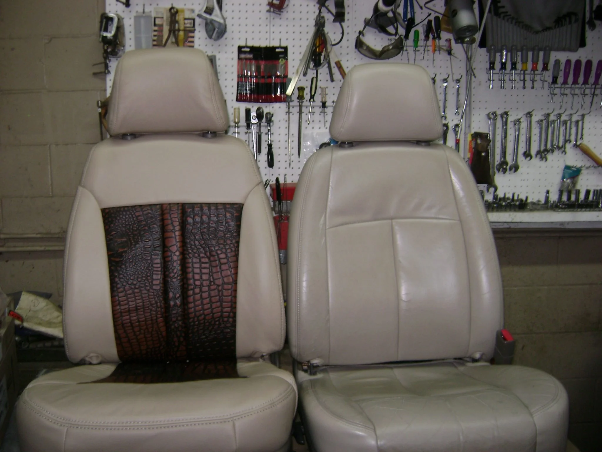 Two beige car seats with crocodile inserts, Katzkin Leather Kit.