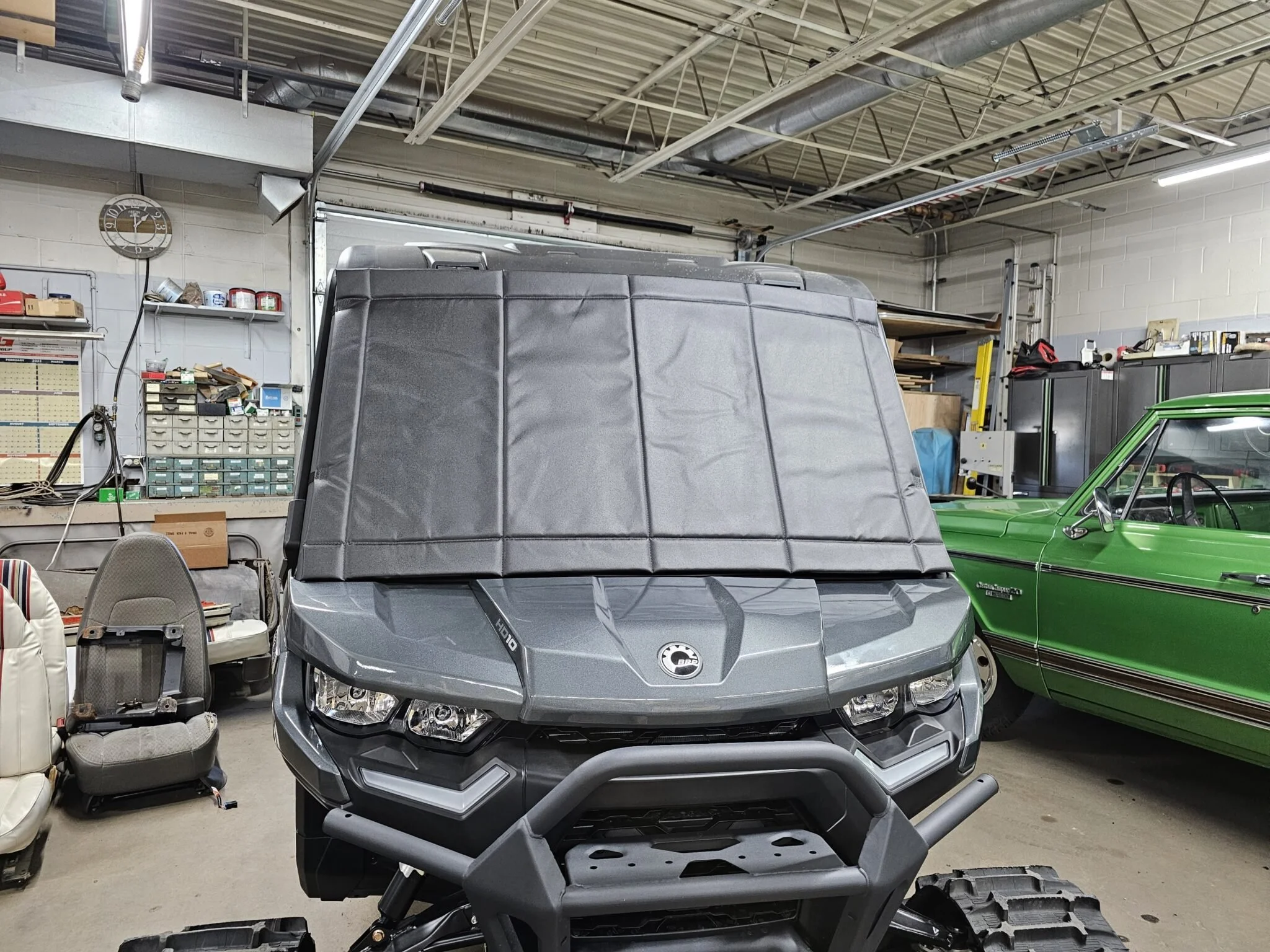Padded windshield cover on ATV/UTV
