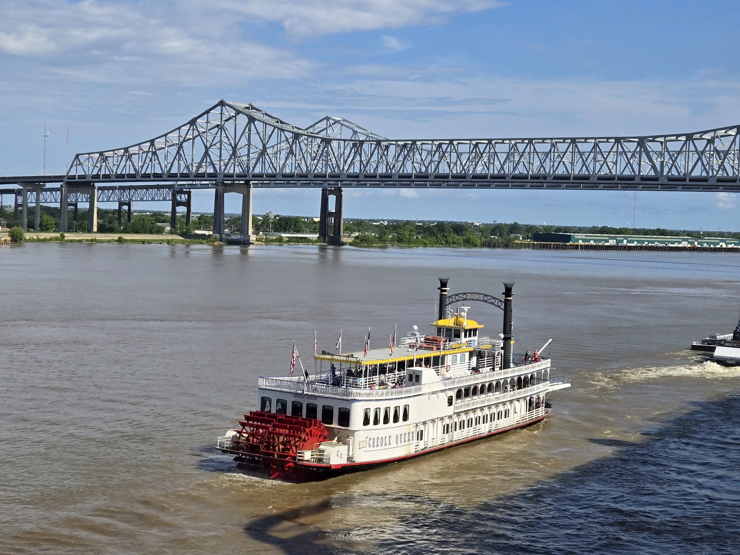 New Orleans Crescent City Connection bridge and River Boat