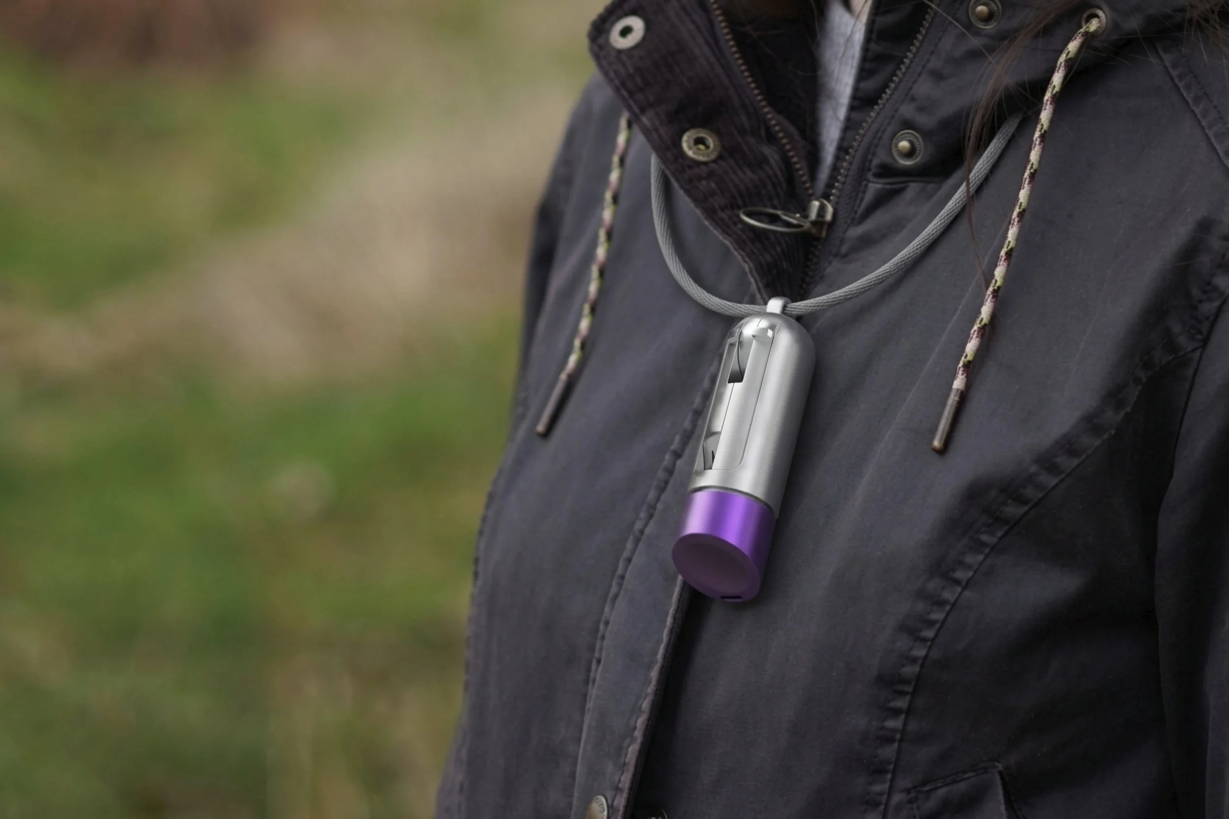 A realistic render of the dog multi tool on a lanyard round a users neck.