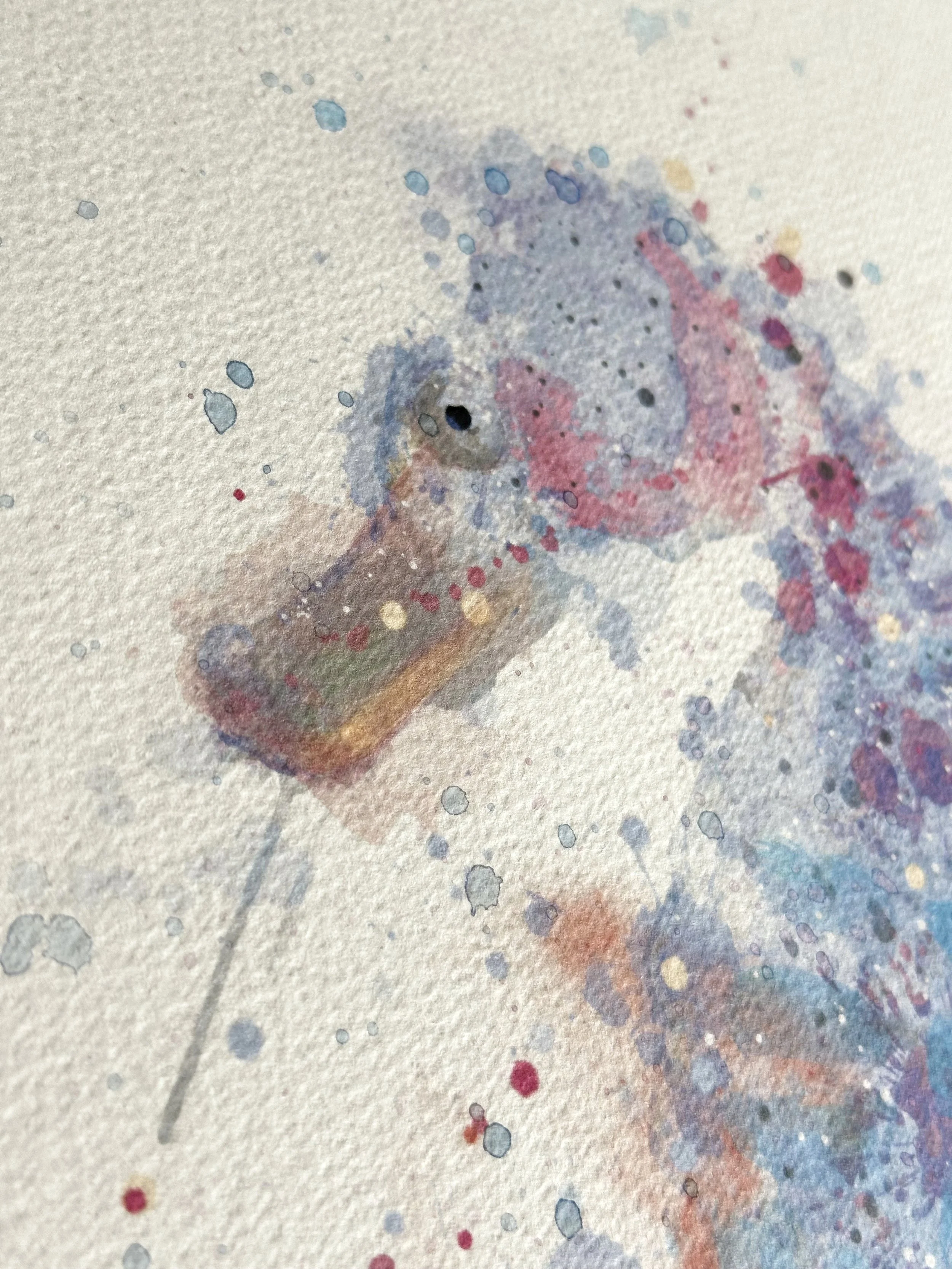 Watercolour portrait of a seahorse, close-up on paint splatters in blue, pink and purple hues
