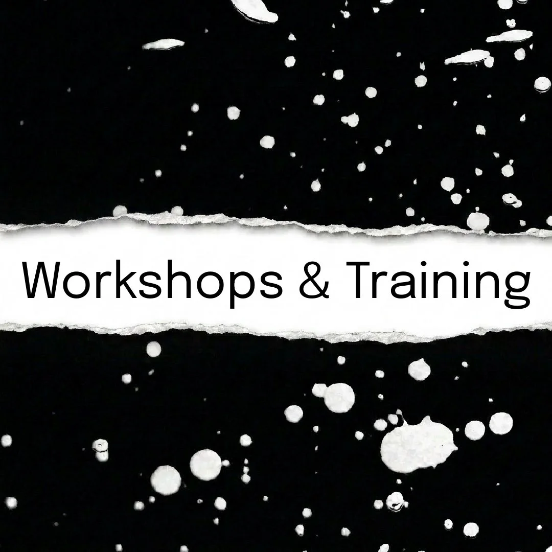 Black background with white paint splatters and torn paper strip with the text 'Workshops & Training'.