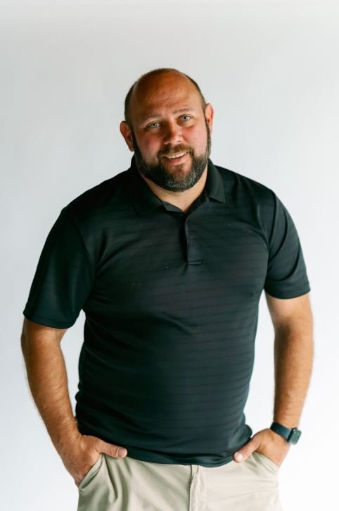 Meet John - hands in pockets, dependable guy