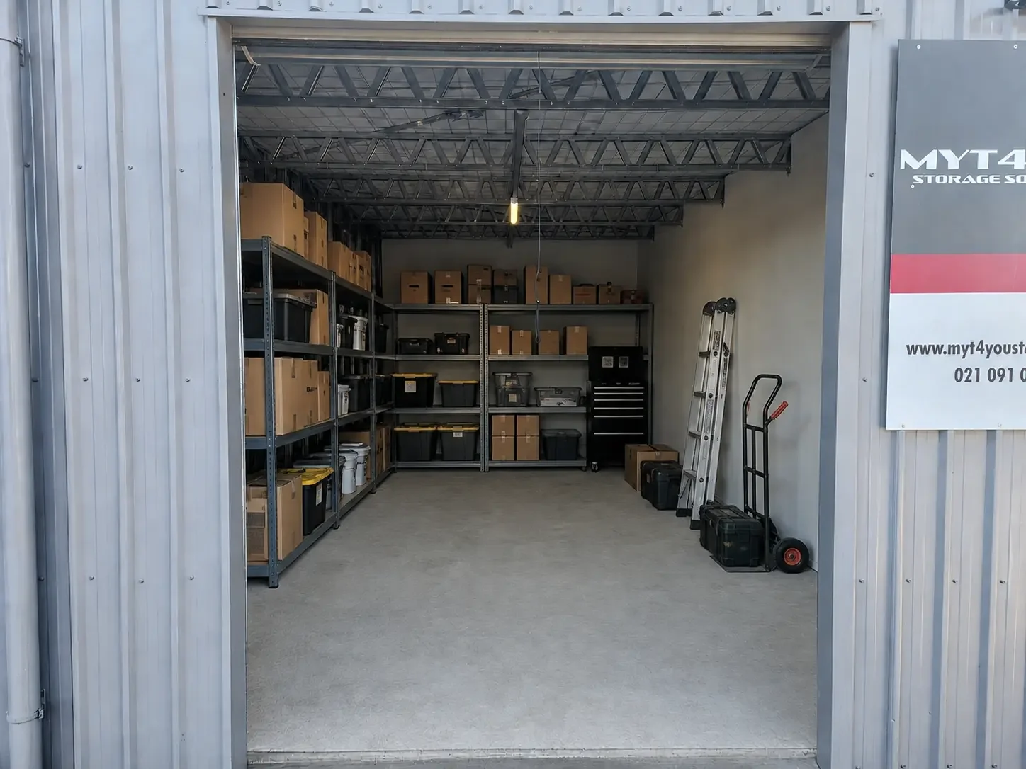 Commercial storage unit with organised business stock and tradie equipment in Ravenswood