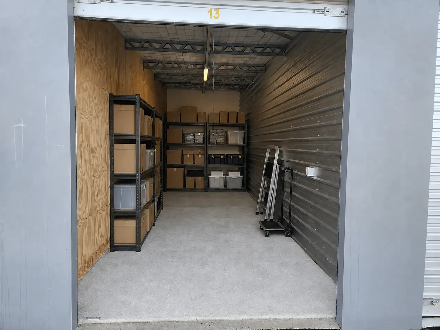Small-business storage unit with organised stock, tools and shelving near Woodend