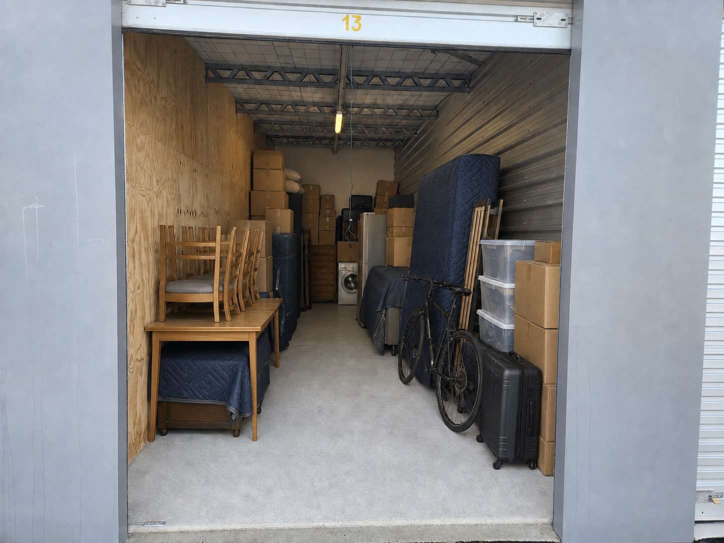 Furniture, boxes and household belongings stored inside a 29.1 m² unit at Myt4you Storage Ravenswood