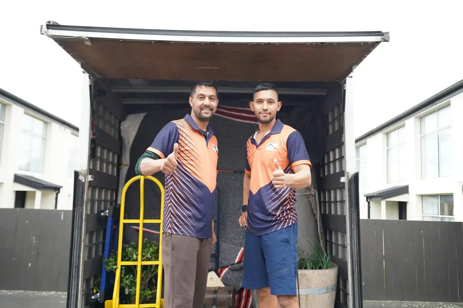 EasyWay Movers team standing beside their moving truck in Christchurch