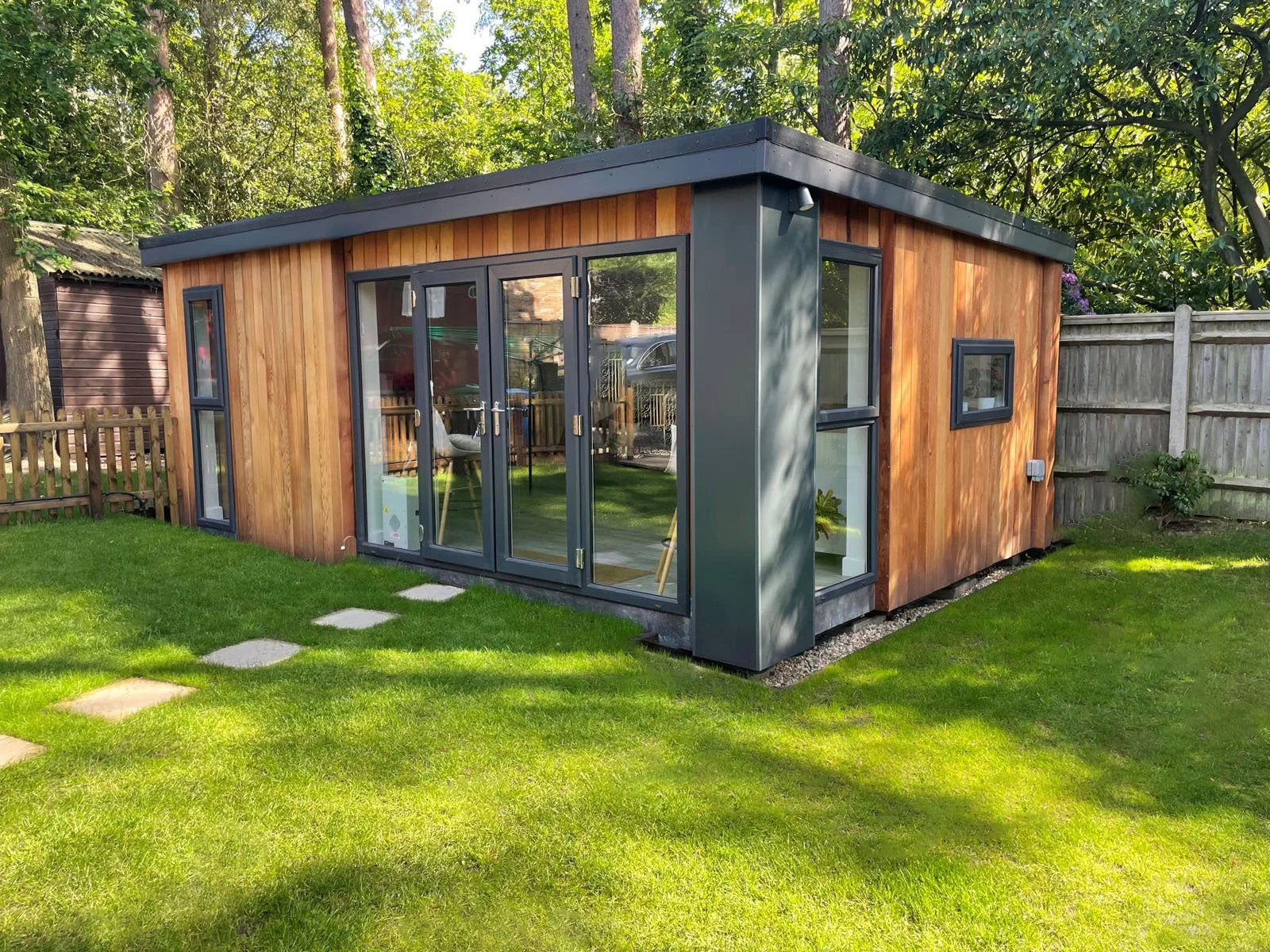 Garden room with multiple windows and French doors for lots of natural light built using SIP panels.