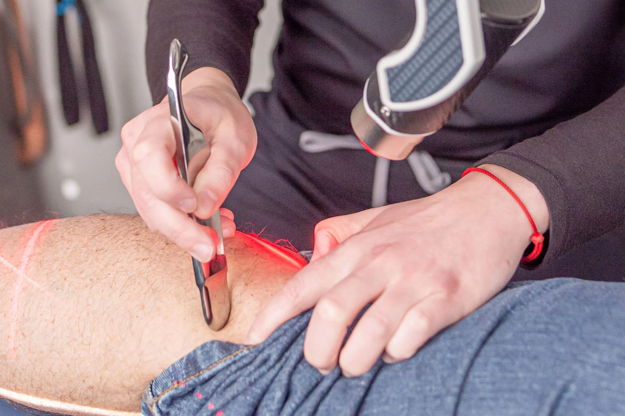 Manual therapy work with laser on a patient at ICE