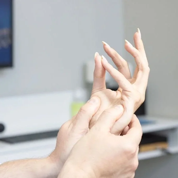 Doctor Joe assessing a hand injury at ICE