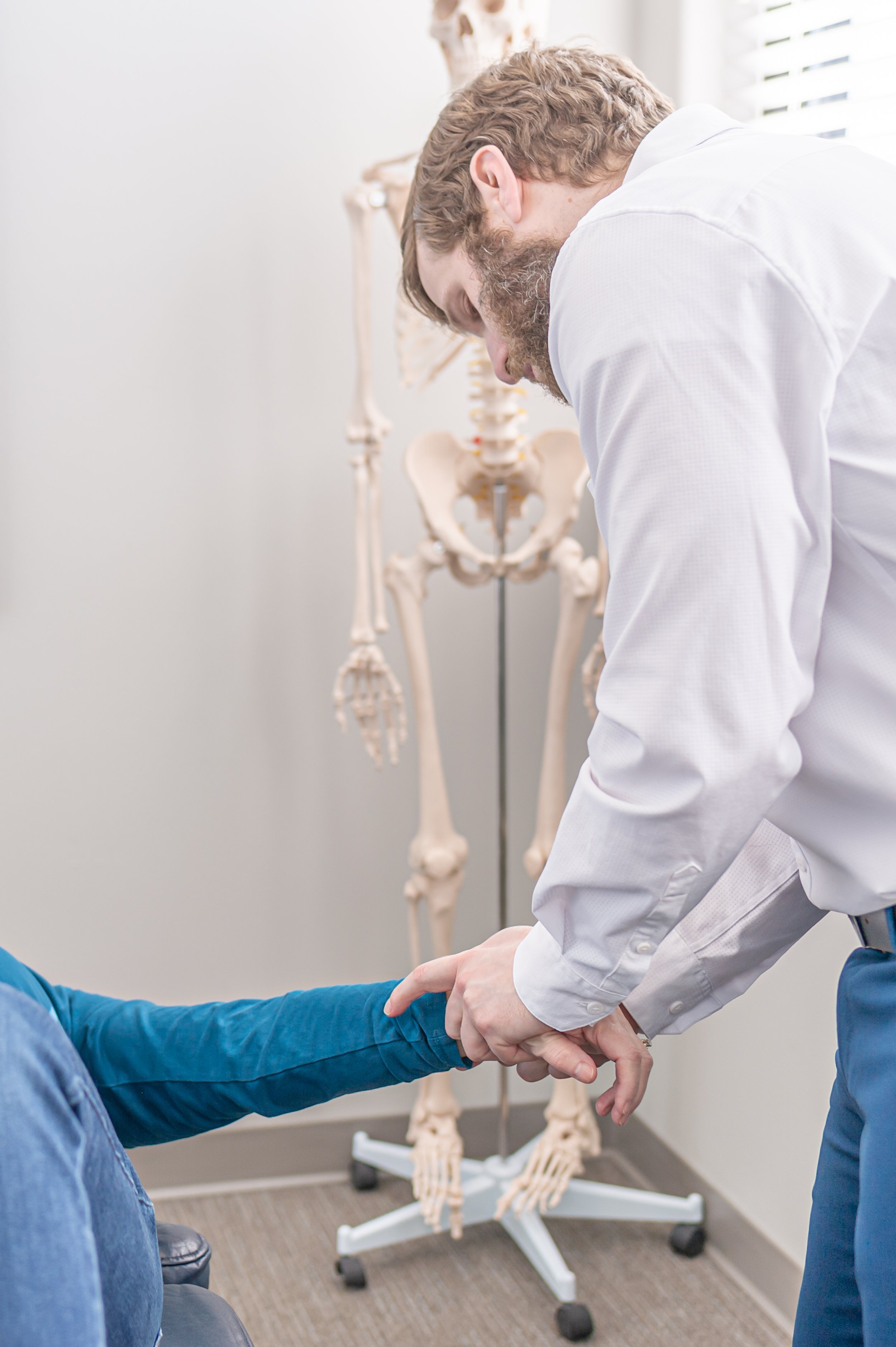 Dr Joe Friedman performing extremity adjustments at ICE