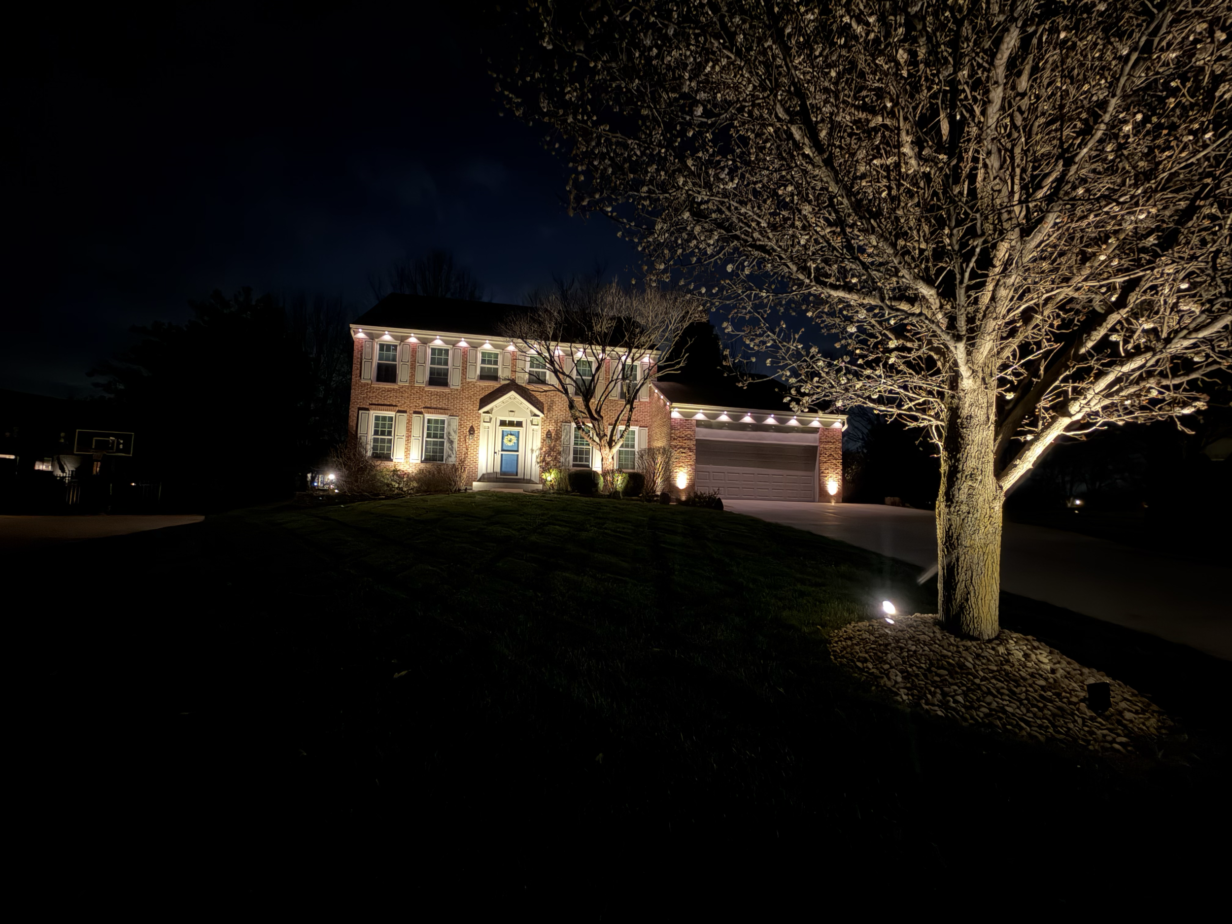 Custom smart landscape lighting installation for a luxury home in Pierce Township, Ohio
