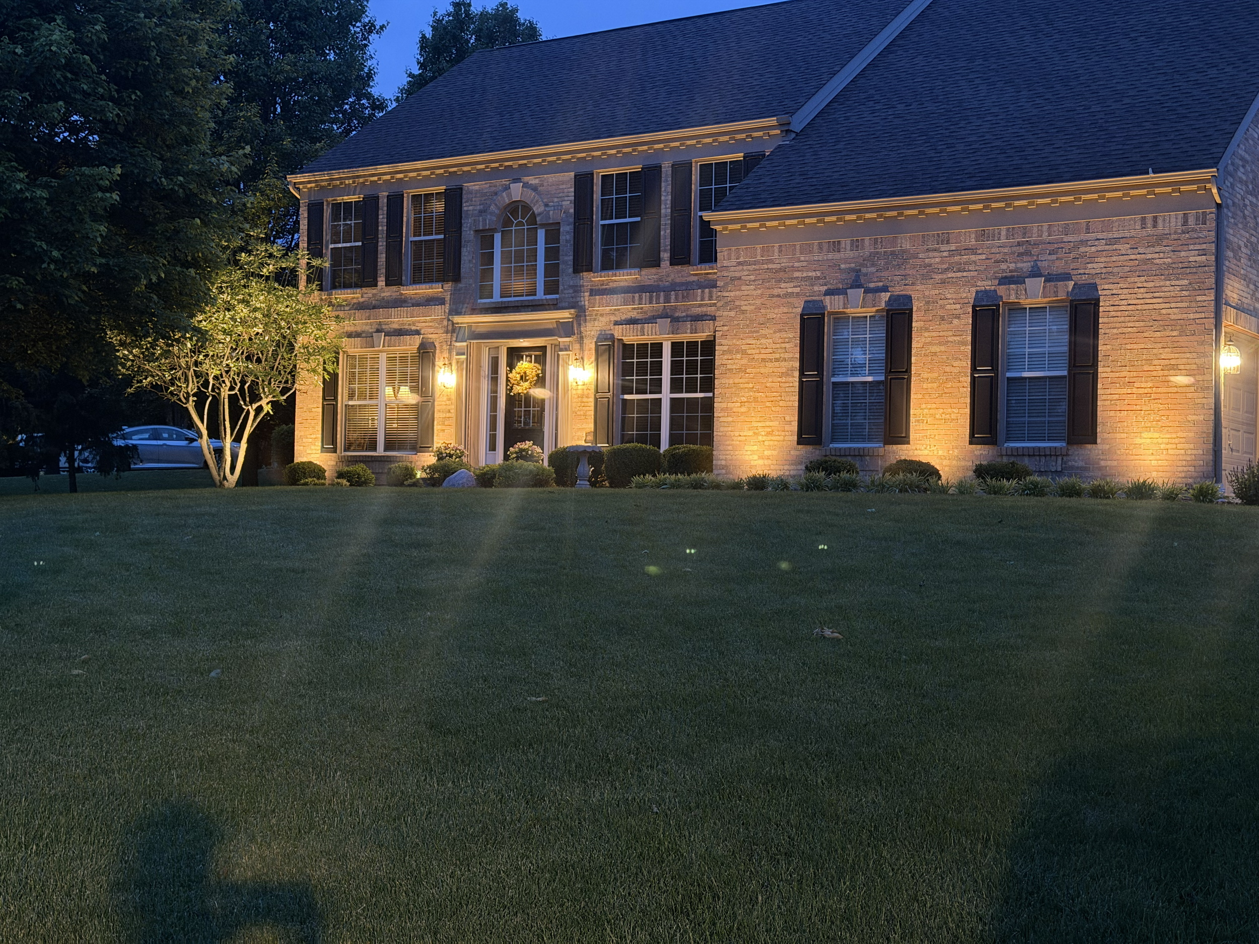 Custom smart landscape lighting installation for a luxury home in Pierce Township, Ohio
