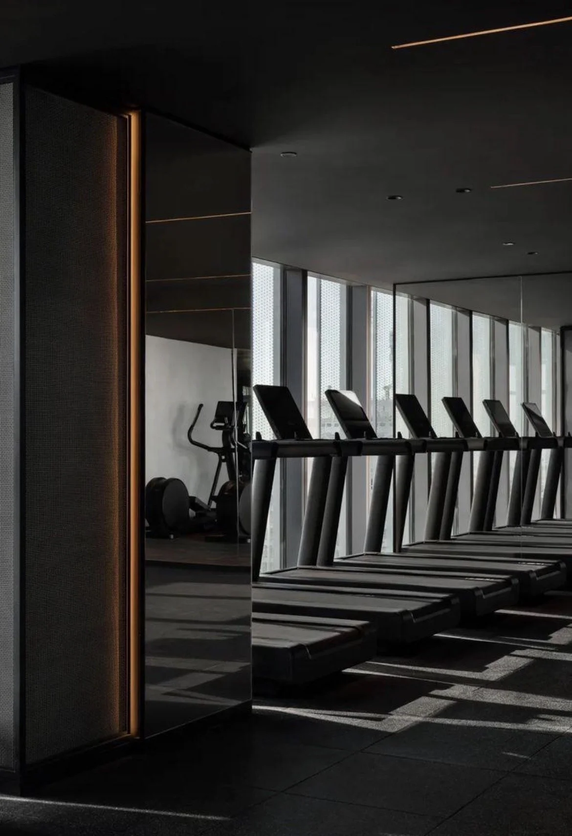 Luxury commercial fitness environment with functional training area, premium gym equipment and wellness design coordinated by Axovent.