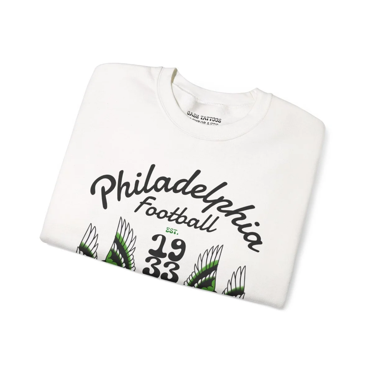 White T-shirt with printed text 'Philadelphia Football 1933' and decorative green and black feathers.