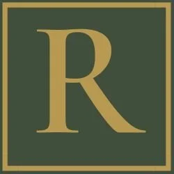 Gold letter R on a dark green background with a gold border