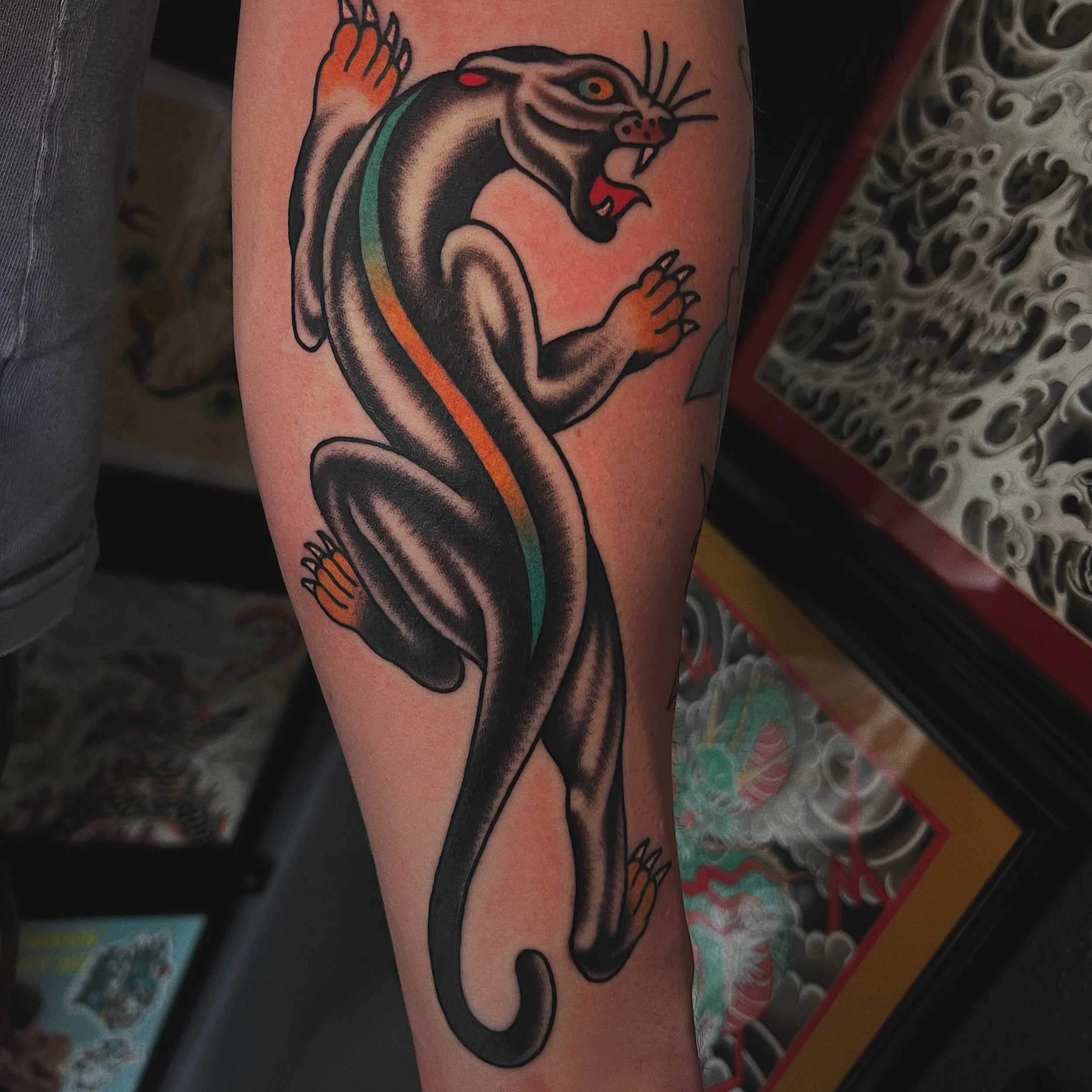American traditional crawling panther tattoo on the arm