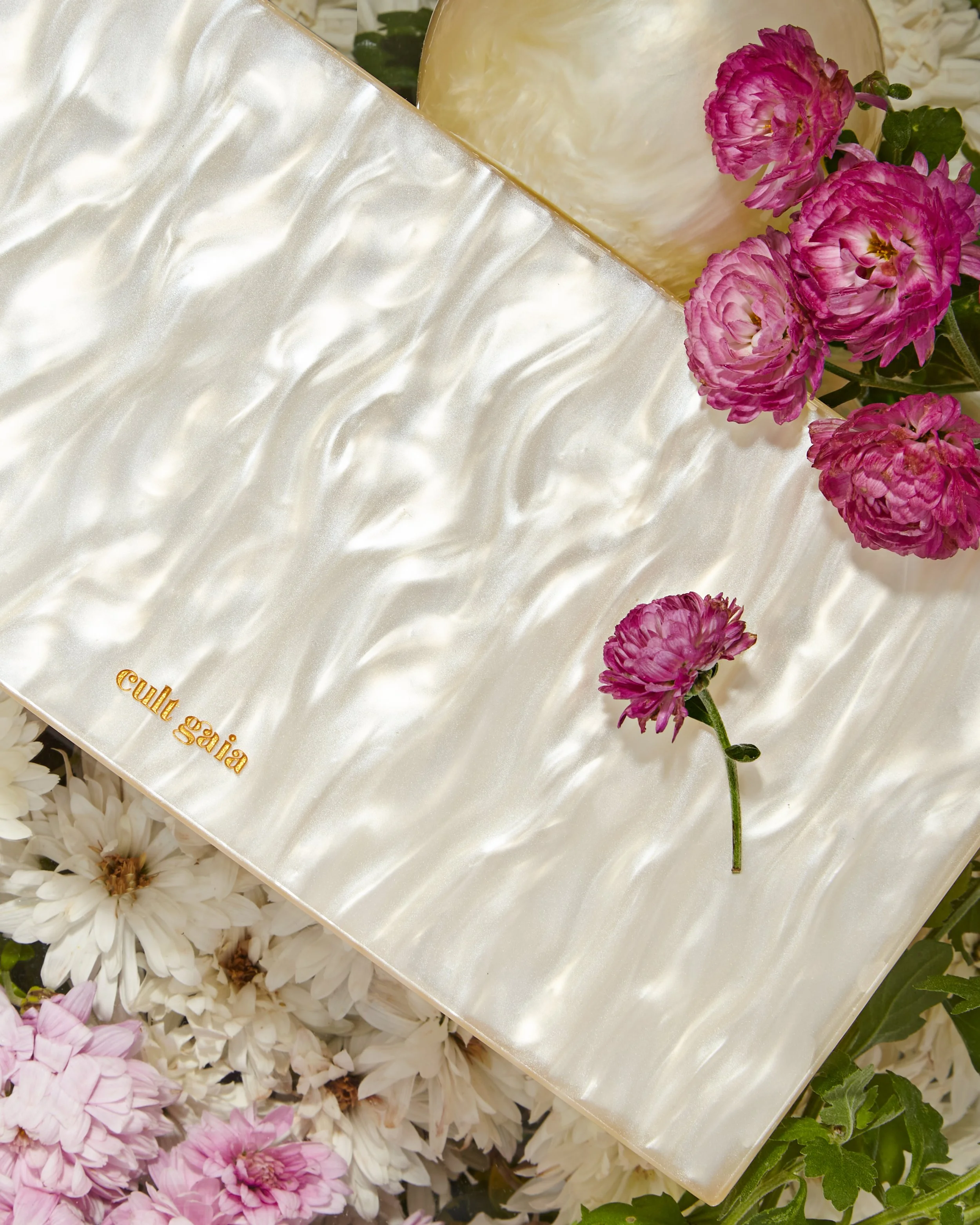 still life floral and purse 
