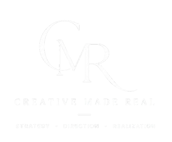 Logo with large stylized 'CMR' and the text 'CREATIVE MADE REAL' below, with the words 'STRATEGY', 'DIRECTION', and 'REALIZATION' separated by dots. Branding and Marketing Assistance