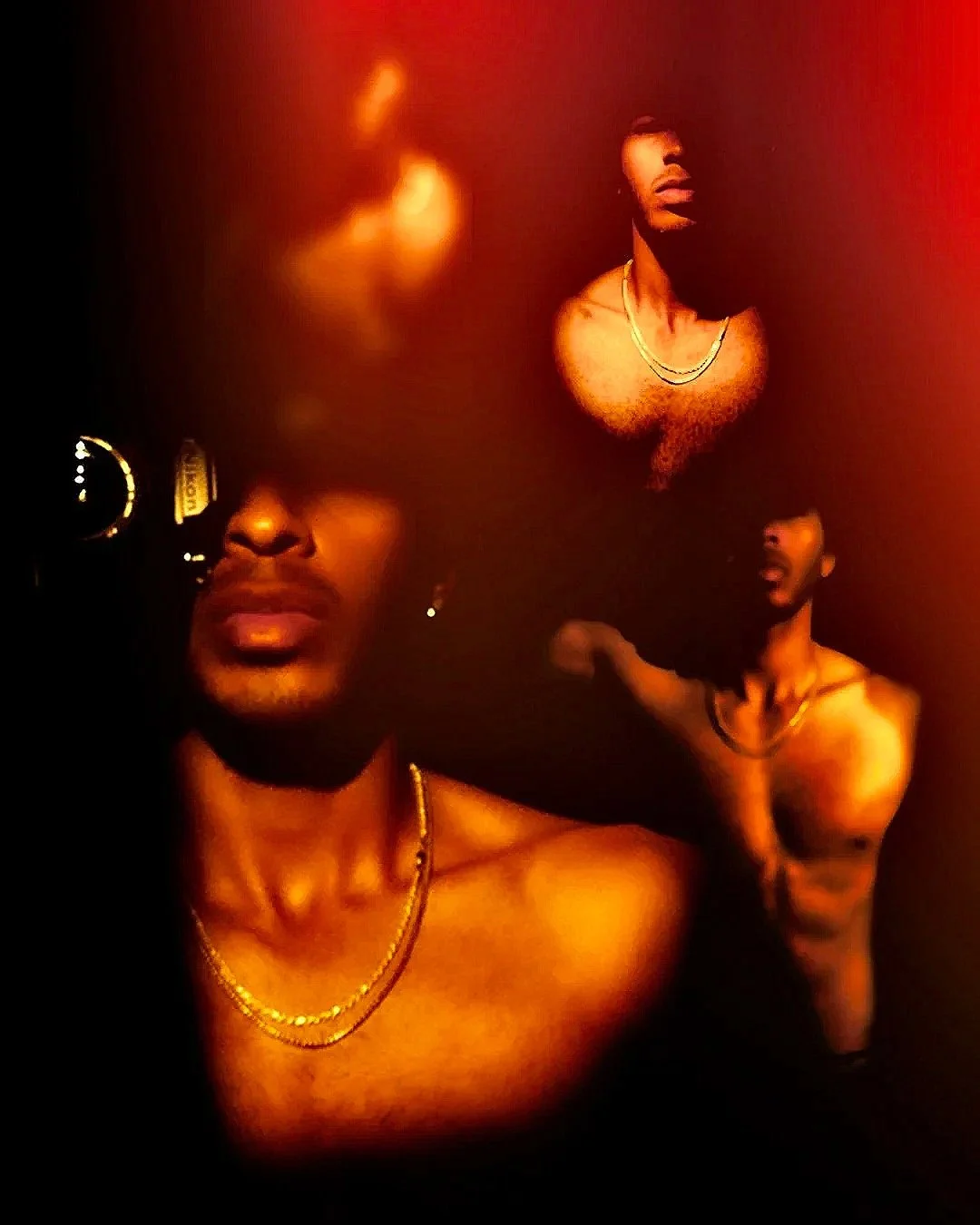 Three shirtless men with gold chains in a dark, red-lit environment, one in the foreground wearing sunglasses and jewelry, the other two in the background with similar attire, posing confidently.
