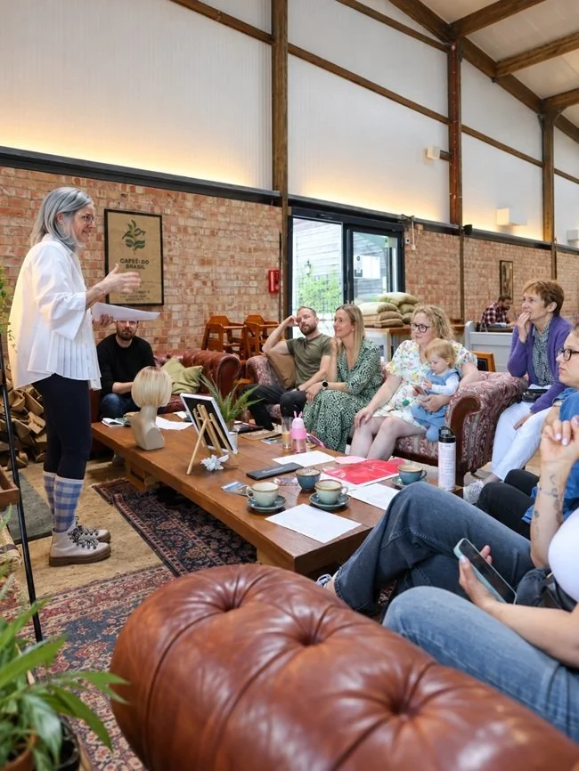 Helena speaking at a Coffee and Connections networking event wearing alternative hair